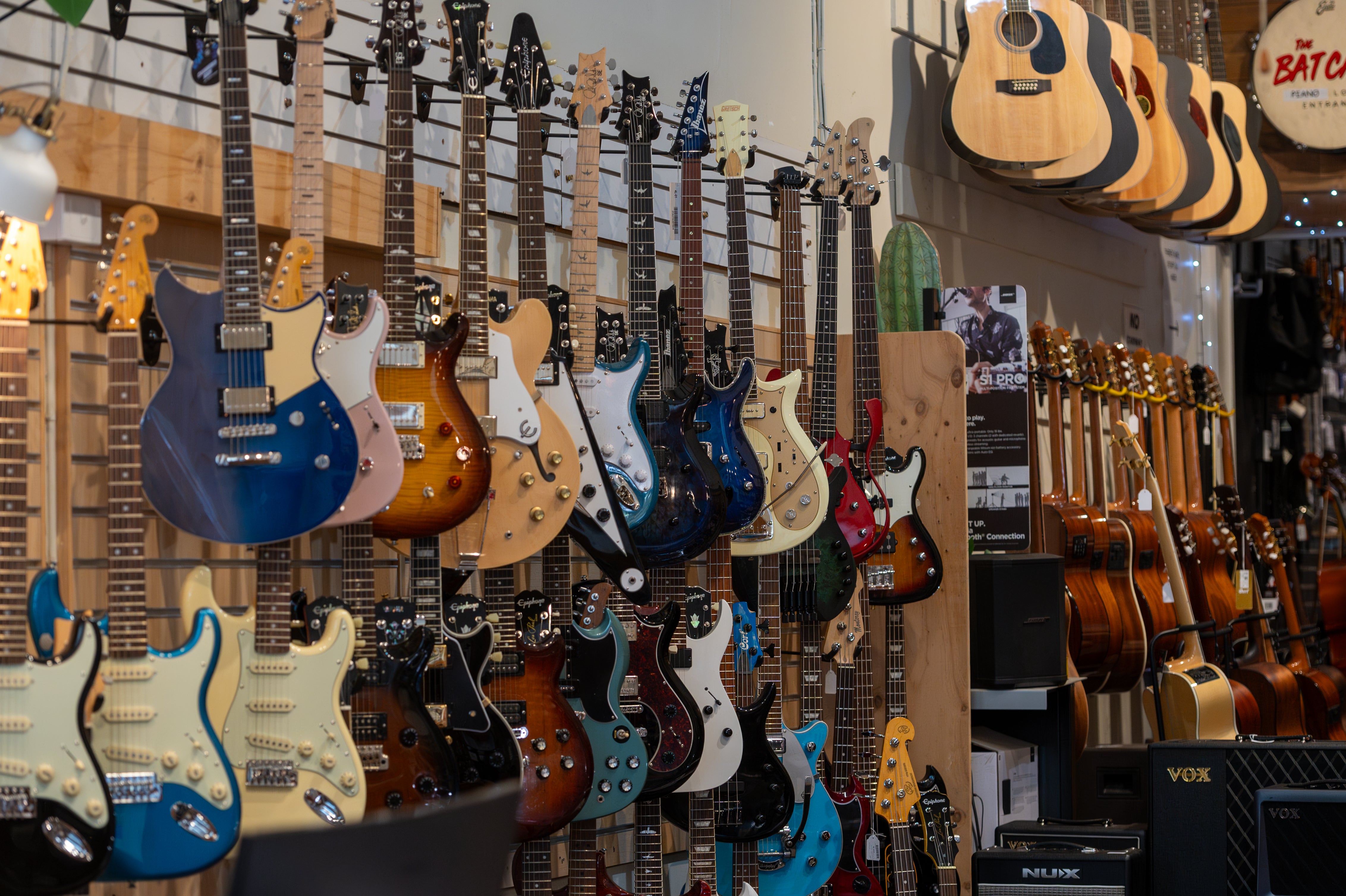 Display of various electric guitars in a music store